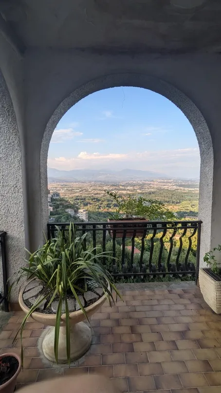 View of Patrica through a stone arch